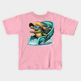 An alligator with a giant swim cap and goggles riding a waterslide Kids T-Shirt